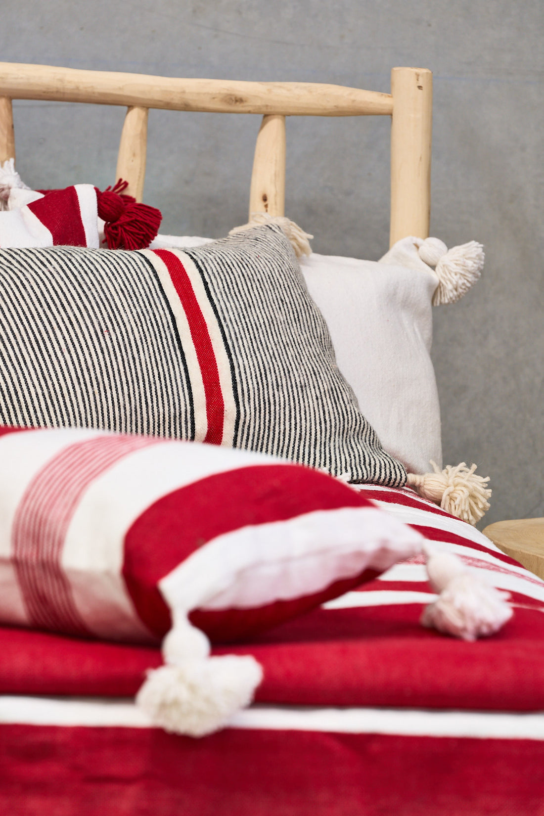 Wool Cushion with Pom Poms 60x40cms Red stripe